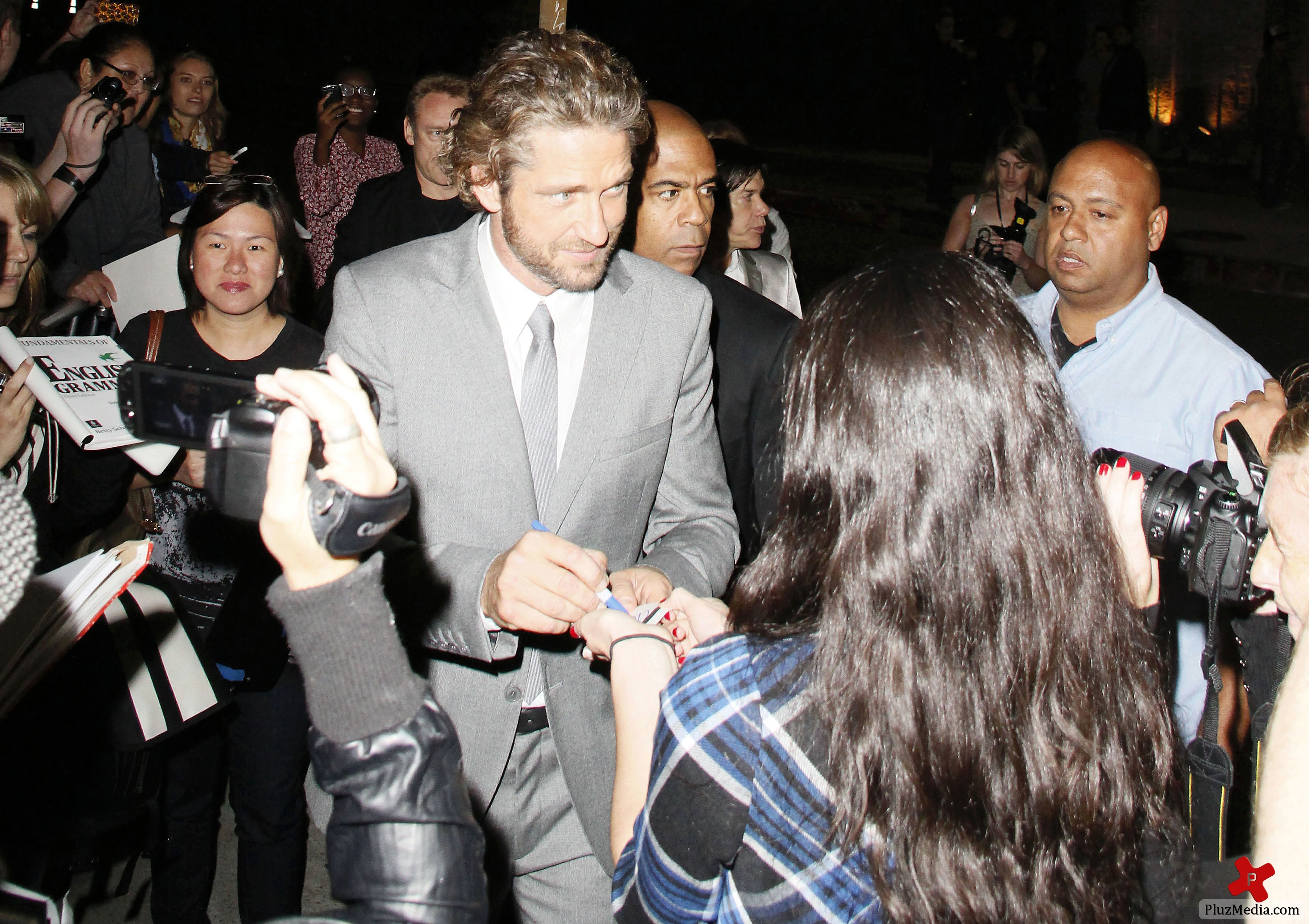 Gerard Butler signs autographs for fans at the 'Machine Gun Preacher' premiere | Picture 84211